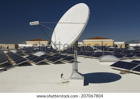 Solar panels and satellite dish at solar power plant