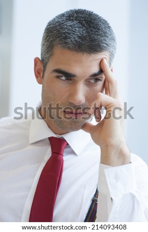 Close-up of pensive Businessman looking off camera