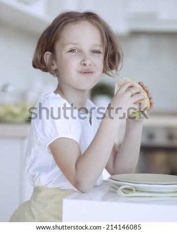 Beautiful Young Girl eating sandwich