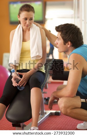 Man and Woman Talking in Health Club