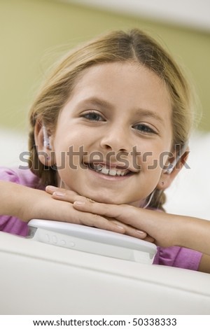 Girl Listening to Portable CD Player