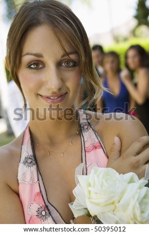 Well-dressed teenage girl outside school dance, portrait