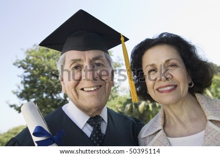 Senior graduate and wife outside, portrait