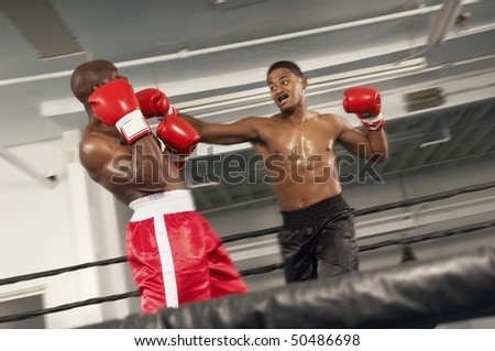 Two boxers fighting in ring