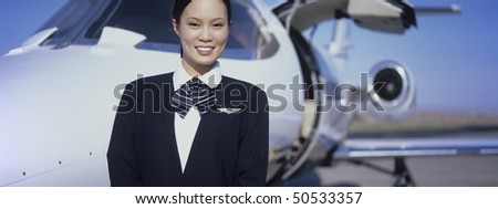 Member of Flight Crew Standing by Airplane