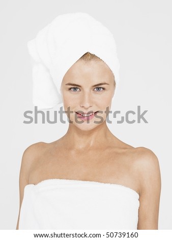 Young Woman with body and head Wrapped in Towels, portrait