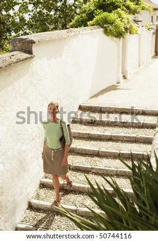 Tourist walking down Steps in Granada, Spain, high angle view