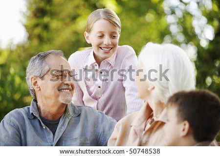 Grandparents with Grandchildren in back yard
