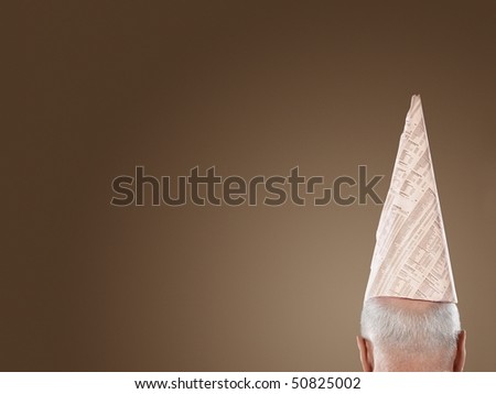 Man Wearing Dunce Hat, high section, back view
