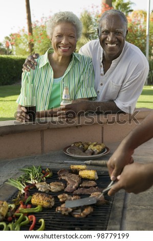 Senior Couple Together at Outdoor Barbecue