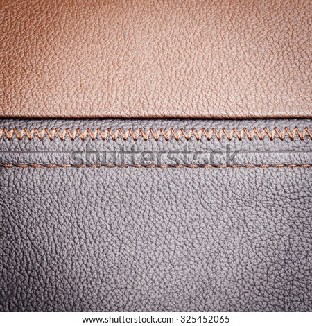 Brown leather sample with  brown stitches, leather texture background
