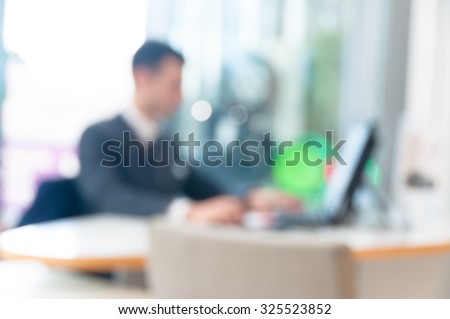 blurred office background , office worker at the computer, working day