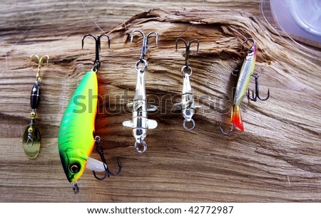 Still-life from baits for fishing on a tree