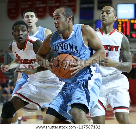 NEW YORK-NOV 3: Sonoma State Seawolves guard Patrick Scott drives to the basket against the St. John\'s Red Storm at Carnesecca Arena on November 3, 2012 in Jamaica, Queens, New York.
