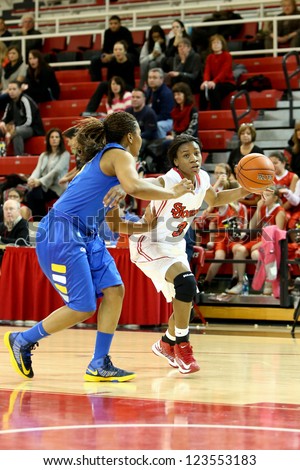 JAMAICA, NY-JAN 2: St. John\'s Red Storm guard Aliyyah Handford (3) drives to the net around Delaware Blue Hens guard Jaquetta May (3) at Carnesecca Arena on January 2, 2013 in Jamaica, New York.