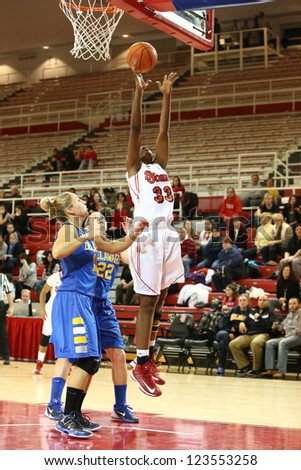 JAMAICA, NY-JAN 2: St. John\'s Red Storm forward Sandra Udobi (33) goes up for a shot against the Delaware Blue Hens at Carnesecca Arena on January 2, 2013 in Jamaica, Queens, New York.