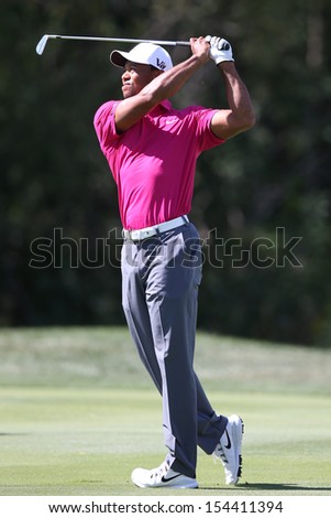 Sep 15, 2013; Lake Forest, IL, USA; Tiger Woods watches his fairway shot on the third hole during the third round of the BMW Championship at Conway Farms Golf Club.