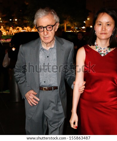 NEW YORK-SEP 24: Woody Allen and Soon Yi Previn attend HUGO BOSS celebrates Columbus Circle BOSS flagship opening on September 24, 2013 in New York City.