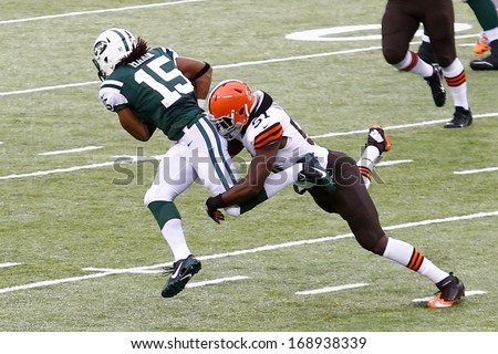 NEW YORK-DEC 22: Cleveland Browns outside linebacker Barkevious Mingo (51) attempts to tackle New York Jets wide receiver Saalim Hakim (15) during the first half at MetLife Stadium.