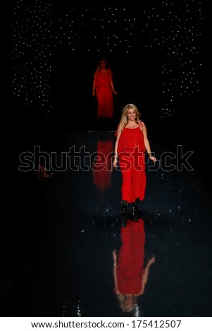 NEW YORK-FEB 6: Host Daphne Oz wears Sarah Liller on the runway at The Heart Truth Red Dress Collection show during Mercedes-Benz Fashion Week at Lincoln Center on February 6, 2014 in New York City.