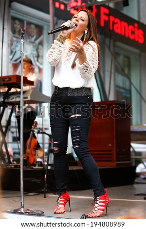 NEW YORK-MAY 23: Country music singer Sara Evans performs at Fox and Friends\' All-American Summer Concert Series at 48th Street and 6th Avenue on May 23, 2014 in New York City.