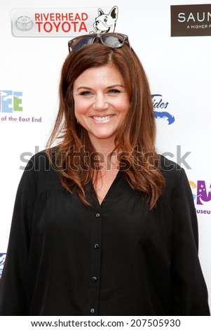 BRIDGEHAMPTON, NY-JUL 19: Actress Tiffani Thiessen attends the 6th Annual Family Fair at the Children\'s Museum of the East End (CMEE) on July 19, 2014 in Bridgehampton, New York.
