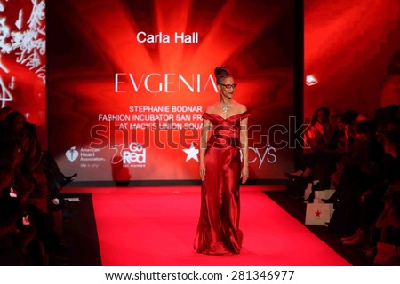 NEW YORK-FEB 12: Chef Carla Hall wears Evgenia at Go Red for Women-The Heart Truth Red Dress Collection at Mercedes-Benz Fashion Week at Lincoln Center on February 12, 2015 in New York City.
