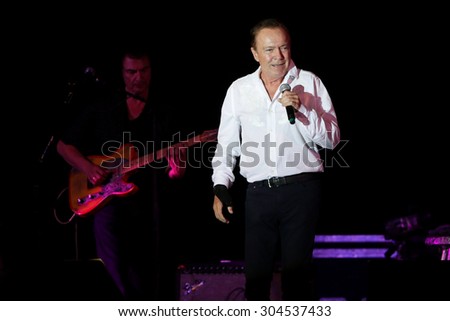 MASSAPEQUA PARK, NY-AUG 8: Musician David Cassidy performs in concert at John J. Burns Park at the Town of Oyster Bay\'??s Music Under the Stars series on August 8, 2015 in Massapequa Park, New York.