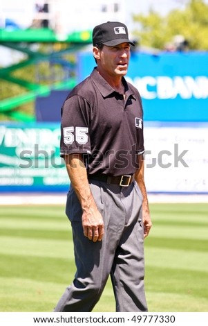 PORT ST. LUCIE, FLORIDA - MARCH 23: Baseball umpire Angel Hernandez walks along third base during a game between the New York Mets and Atlanta Braves on March 23, 2010 in Port St. Lucie, Florida.