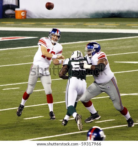 EAST RUTHERFORD, NJ - AUGUST 16: New York Giants Quarterback Eli Manning in action against the New York Jets at MetLife stadium on August 16, 2010 in East Rutherford, New Jersey.