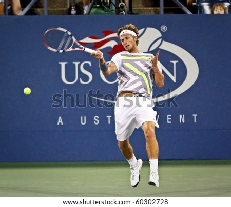 FLUSHING, NY - SEPTEMBER 2: Peter Polansky of Canada returns a volley during his men\'s singles match at the US Open at the Billie Jean National Tennis Center on September 2, 2010 in Flushing, NY.