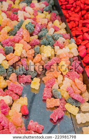 Background made of colorful sweets and candies. assortment colorful gummy candies at market