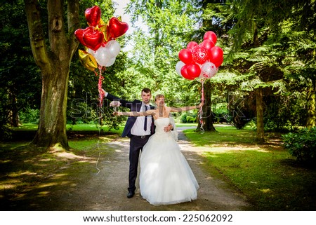 Couple of bride and groom with balloons