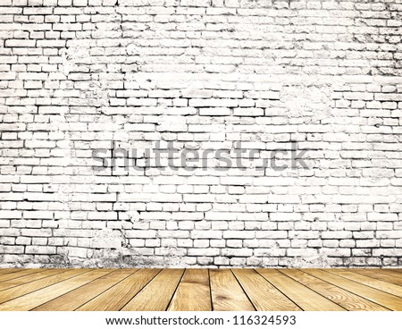 Old brick wall on wood floor