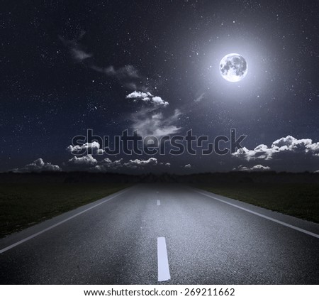 Asphalt road through the green field and moonlight. Elements of this image furnished by NASA