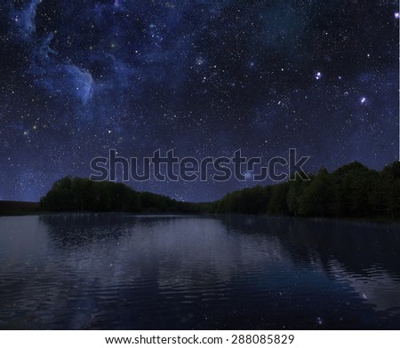 The big wood lake at night with sky with stars. Elements of this image furnished by NASA