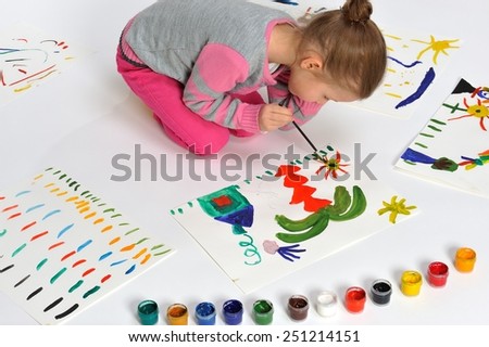 This painting is for my mummy. Little girl is drawing on paper.