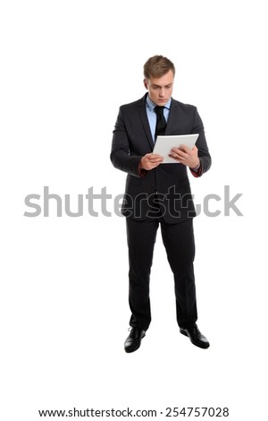 What kind of information is this? There is nothing useful for me in this magazine! Businessman with magazine isolated on white background.