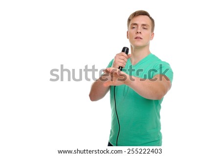 Sorry, can you repeat your question, please? Attractive man with a microphone is delivering a speech.