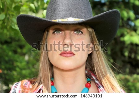 one girl on the nature dressed in western style