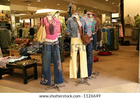 A photo of mannequins displaying colorful girls fashion
