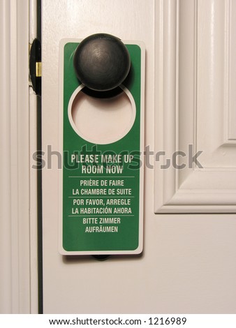 A photo of a clean room sign on a hotel door
