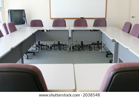 A conference room with the tables arranged to form a square