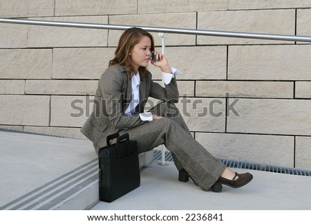 A business woman on the phone talking to clients