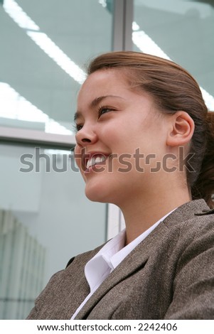 A beautiful business woman inside a corporate office building
