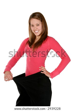 A pretty woman wearing her old pants before her weight loss