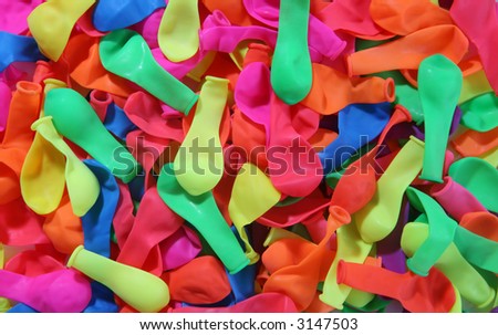 A colorful background of lots of different deflated balloons