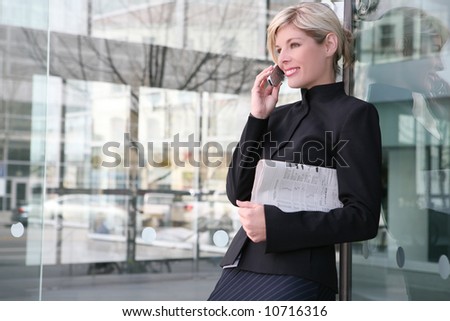 A beautiful blonde business woman on the phone