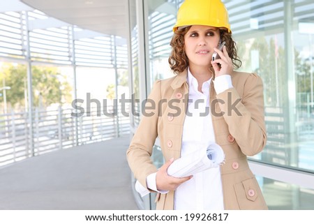 A pretty business construction woman at office building
