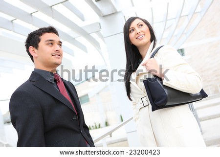 Attractive diverse man and woman business team at office building